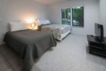 Fifth bedroom has a queen and twin bed with detached full bath.